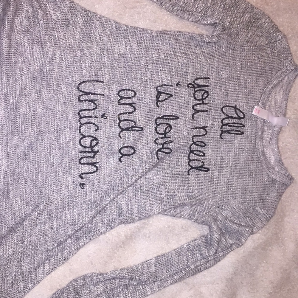Gray long sleeve shirt with text
